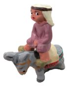 Niño montado en burro